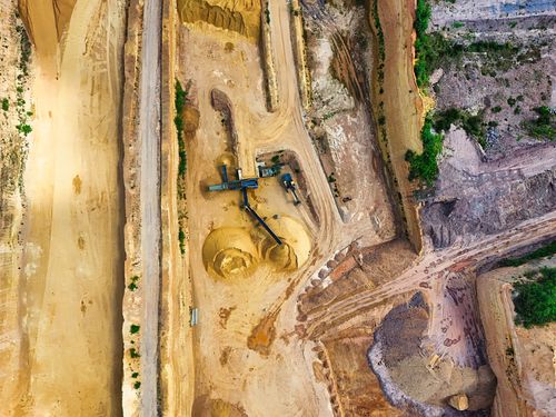 Mining professional overlooking an active operations site